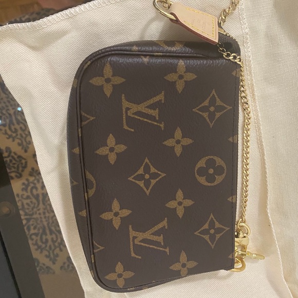 Mini pochette in monogram - Picture 1 of 16